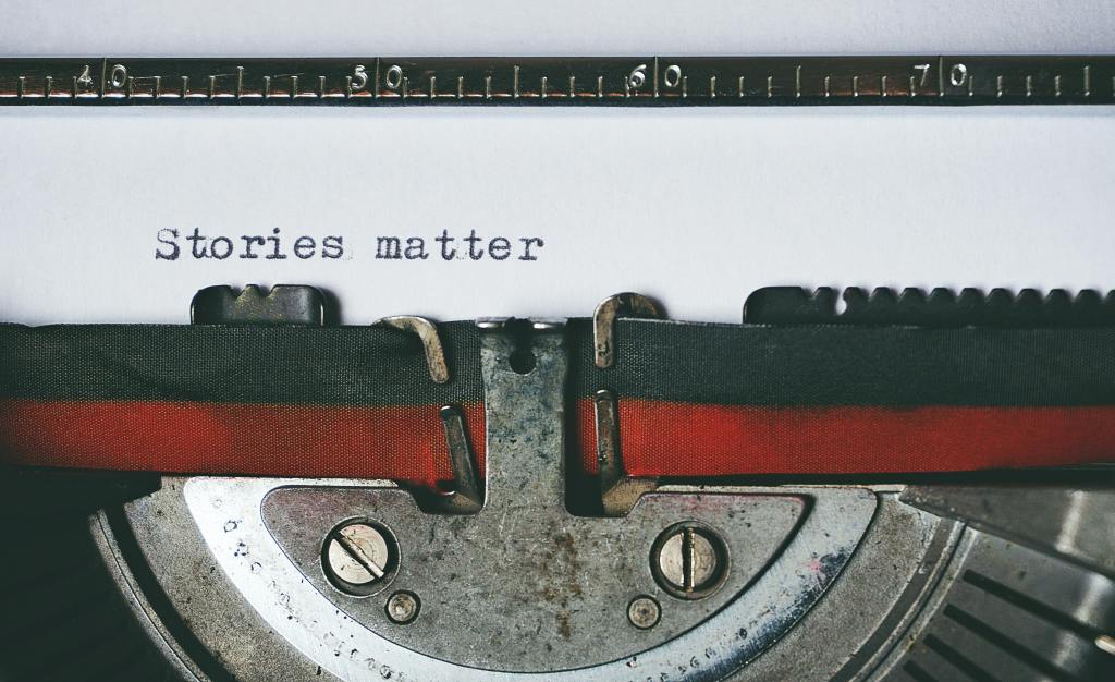 Close-up of typewriter with the the words “stories matter” typed.