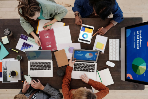 People sitting around an office table designing a business communication strategy.